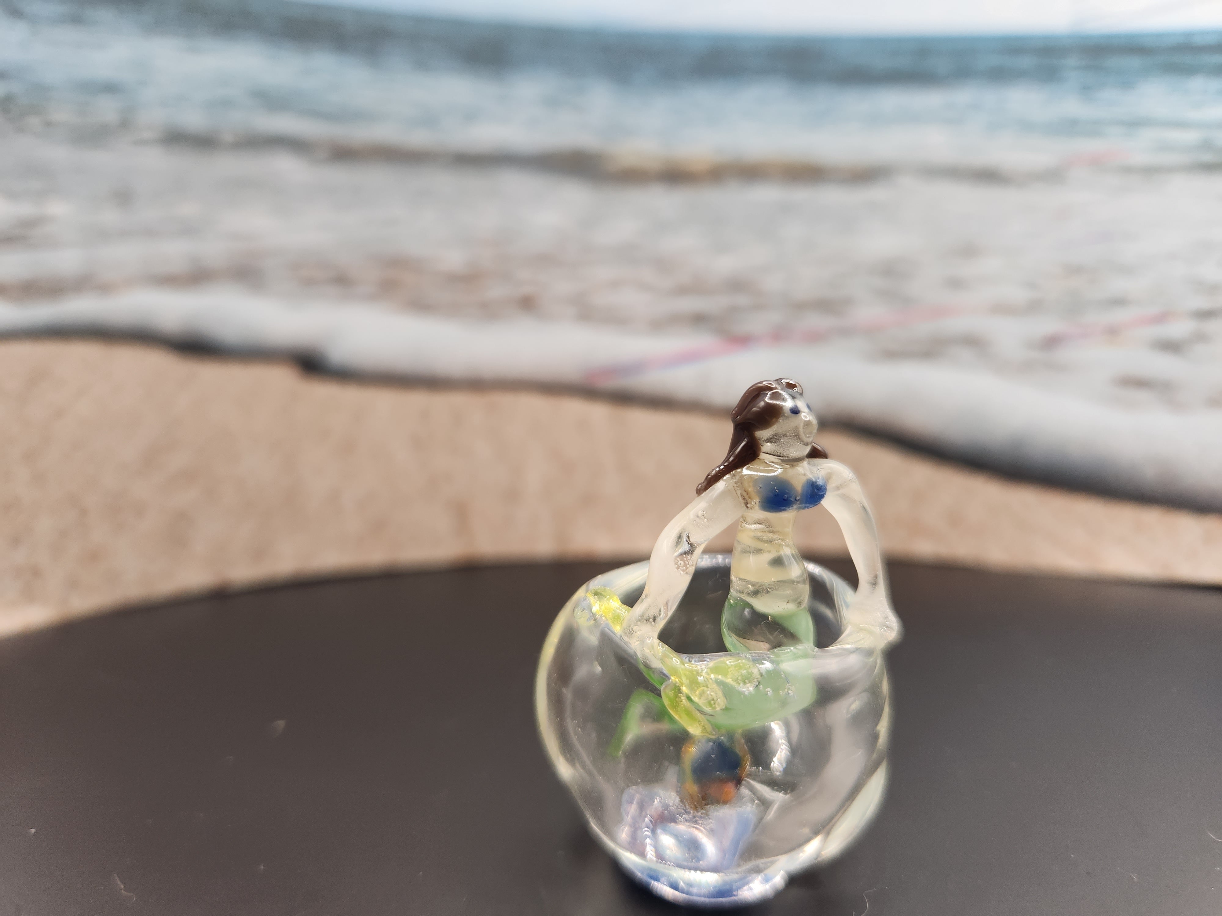 Glass miniature of a mermaid in a fish bowl