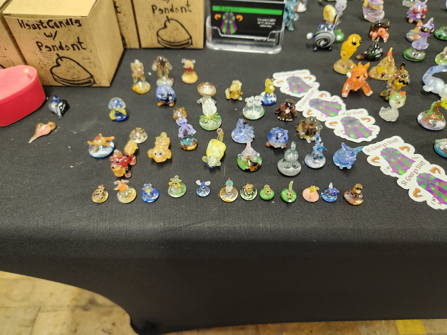 Glass pokemon figures displayed on a black table cloth. Extra small sized, made by St George Stuff